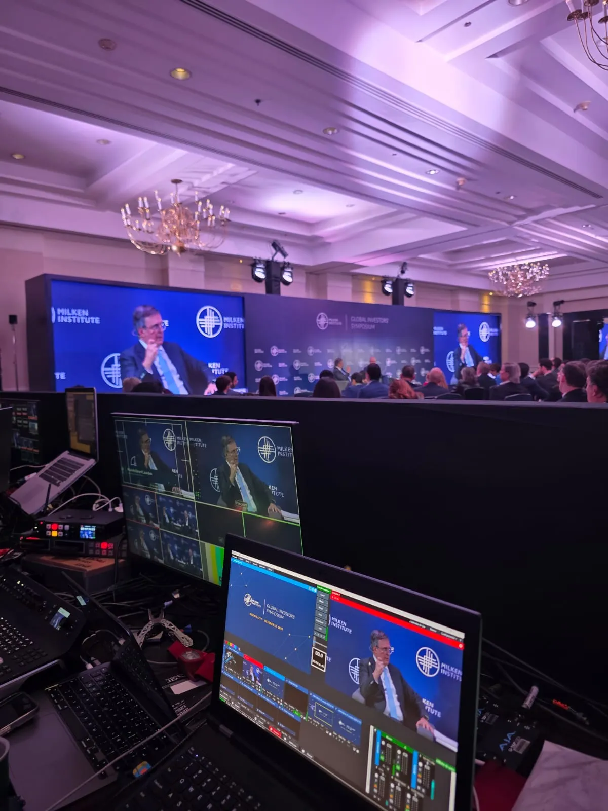 Video control position at the back of the Milken Institute plenary hall.