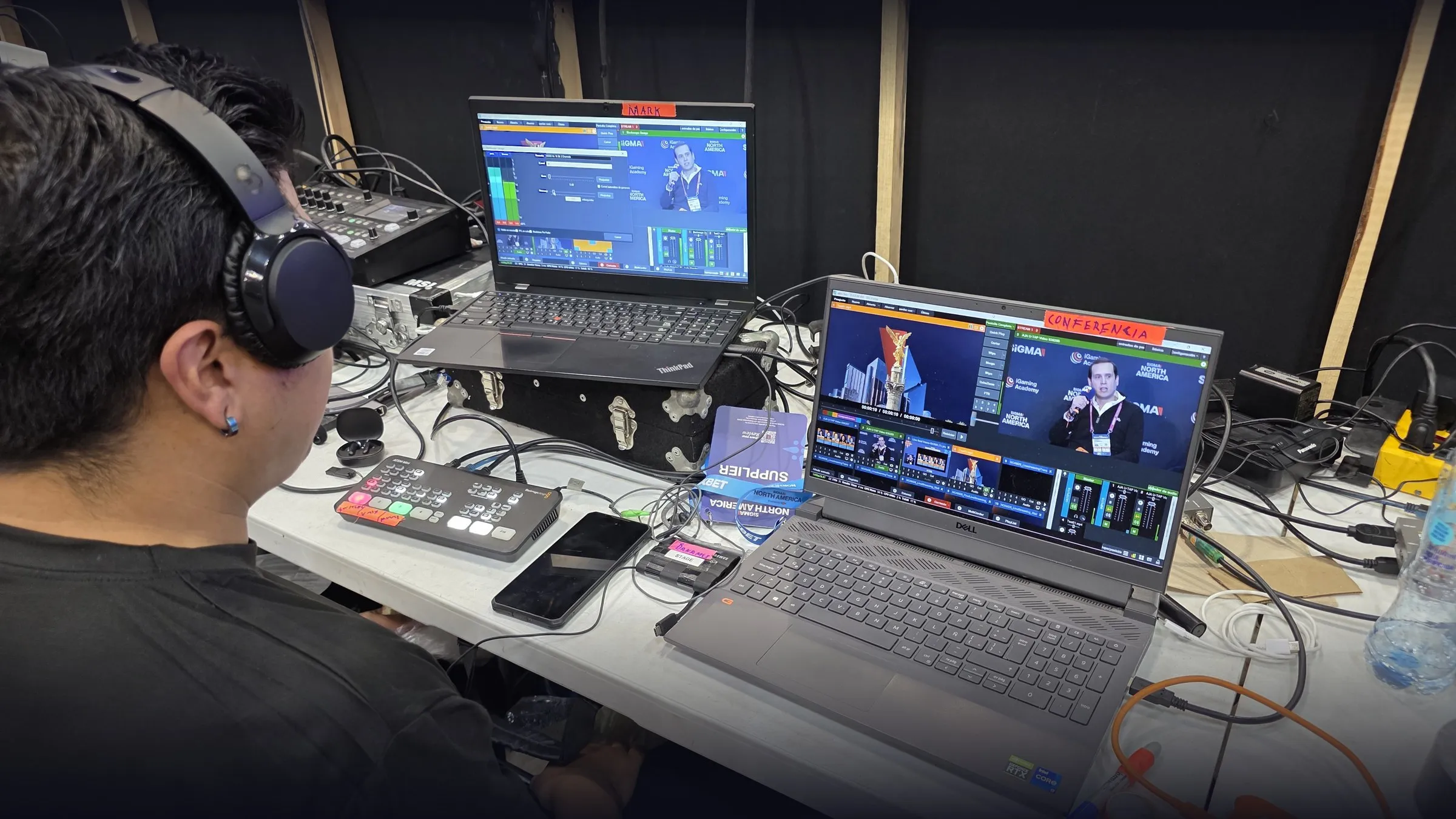 Operator running the live stream for SiGMA North America 2026 in Mexico City, with switching and streaming laptops.